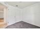 A well lit bedroom featuring gray carpet and white walls at 11837 Thicket Wood Dr, Riverview, FL 33579