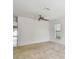 Comfortable bedroom features neutral carpet, a ceiling fan, and a bright window at 11837 Thicket Wood Dr, Riverview, FL 33579