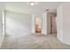 Bright bedroom featuring neutral carpet and a door to the ensuite bathroom at 11837 Thicket Wood Dr, Riverview, FL 33579