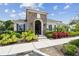 Community clubhouse featuring stone accents, manicured landscaping, and a welcoming entrance at 11837 Thicket Wood Dr, Riverview, FL 33579