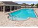 Inviting community pool with a clean design and relaxing covered lounge area at 11837 Thicket Wood Dr, Riverview, FL 33579