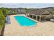 Spacious community pool with lounge seating and a shaded pavilion area at 11837 Thicket Wood Dr, Riverview, FL 33579