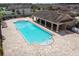 Spacious community pool with plenty of lounge chairs and covered seating area at 11837 Thicket Wood Dr, Riverview, FL 33579