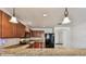 Well-lit kitchen with granite countertops, pendant lighting, and stainless steel appliances at 11837 Thicket Wood Dr, Riverview, FL 33579