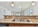 A kitchen sink with granite countertops provides plenty of food prep space at 11837 Thicket Wood Dr, Riverview, FL 33579