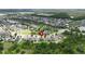 Aerial photo of a residential area featuring a large backyard with a playset and nearby community amenities at 12316 Streambed Dr, Riverview, FL 33579