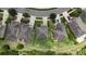 Overhead shot of a property with a big backyard with playset, and a meticulously kept lawn at 12316 Streambed Dr, Riverview, FL 33579