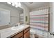 This bathroom has a single sink vanity and a shower/tub combo at 12316 Streambed Dr, Riverview, FL 33579