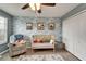 This bedroom has wave-themed wallpaper, a closet, and a crib at 12316 Streambed Dr, Riverview, FL 33579
