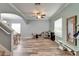 Spacious bonus room with wood-look floors, recessed lighting, and natural light at 12316 Streambed Dr, Riverview, FL 33579