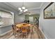 Open dining room area with light-colored walls, wood-look floors and natural light at 12316 Streambed Dr, Riverview, FL 33579