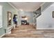 Inviting entryway featuring wood-look floors, a bench, and coat storage at 12316 Streambed Dr, Riverview, FL 33579