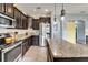 Traditional kitchen featuring granite countertops, stainless steel appliances and a kitchen island at 12316 Streambed Dr, Riverview, FL 33579