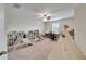 Large playroom with neutral walls, ceiling fan, and an abundance of space at 12316 Streambed Dr, Riverview, FL 33579