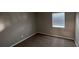 Bedroom with carpeted floors, neutral paint, and a window at 12804 Millridge Forest St, Tampa, FL 33624
