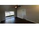 Spacious living room features an attractive fan and sliding glass doors to the patio at 12804 Millridge Forest St, Tampa, FL 33624