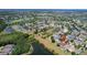 Aerial view of neighborhood with lakes and natural preserve surrounding homes at 13910 Chalk Hill Pl, Riverview, FL 33579