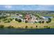 Distant aerial view of home in neighborhood with lake and natural preserve at 13910 Chalk Hill Pl, Riverview, FL 33579