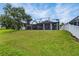 Well-maintained backyard with a screened-in patio area, perfect for outdoor relaxation and entertainment at 13910 Chalk Hill Pl, Riverview, FL 33579
