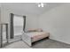 Cozy bedroom featuring neutral decor, a comfortable bed, and a bright window at 13910 Chalk Hill Pl, Riverview, FL 33579