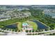 Aerial view of community with lake, pool, and playground at 13910 Chalk Hill Pl, Riverview, FL 33579