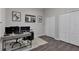 Well-organized office featuring laminate flooring, dual monitors, and ample storage space at 13910 Chalk Hill Pl, Riverview, FL 33579