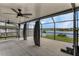Expansive screened patio offering serene lake views, perfect for outdoor entertainment and relaxation at 13910 Chalk Hill Pl, Riverview, FL 33579