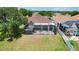 Aerial view of the screened lanai, patio, and backyard at 13910 Chalk Hill Pl, Riverview, FL 33579