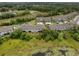 An aerial view of residences surrounded by lush greenery and serene ponds at 1395 White Fox Run, Lutz, FL 33549