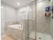 Beautiful bathroom featuring a separate shower and luxurious soaking tub at 1395 White Fox Run, Lutz, FL 33549