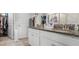 Bright bathroom with double granite vanity and walk-in shower, provides a luxurious space at 1395 White Fox Run, Lutz, FL 33549