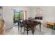 The dining area features a table and chairs with sliding glass doors to the outside patio at 1395 White Fox Run, Lutz, FL 33549