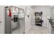 Stainless steel refrigerator situated adjacent to hallway at 1395 White Fox Run, Lutz, FL 33549