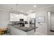This kitchen has white cabinets and black countertops, along with stainless steel appliances at 1395 White Fox Run, Lutz, FL 33549