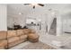 A spacious living room flows into the kitchen, with modern tile flooring and ample natural light at 1395 White Fox Run, Lutz, FL 33549