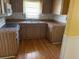 Functional kitchen featuring laminate countertops and ample wood-look cabinetry at 15034 Lake Magdalene Blvd, Tampa, FL 33618