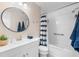 Well-lit bathroom with modern fixtures, ample storage, and a combined tub and shower at 213 Fernwood Cir # 213, Seminole, FL 33777