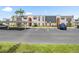 Well-maintained condo building with covered parking and mature landscaping at 213 Fernwood Cir # 213, Seminole, FL 33777
