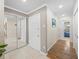 Inviting hallway featuring neutral paint, mirrored closet, and doorways to other rooms at 213 Fernwood Cir # 213, Seminole, FL 33777