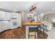 Beautiful kitchen featuring custom cabinetry, modern lighting, and an expansive island at 213 Fernwood Cir # 213, Seminole, FL 33777