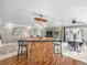 Eat-in kitchen with breakfast bar and modern lighting at 213 Fernwood Cir # 213, Seminole, FL 33777