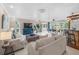 Open living space with tile flooring, neutral decor, and a bar-style eating area at 213 Fernwood Cir # 213, Seminole, FL 33777