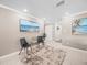 Sitting area featuring tile flooring, neutral colored walls, and coastal-themed decor at 213 Fernwood Cir # 213, Seminole, FL 33777