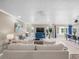 Open-concept living area with neutral walls, tile floors, and large windows at 213 Fernwood Cir # 213, Seminole, FL 33777