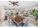 Open-concept living space with dining area, living room, and eat-in kitchen with breakfast bar at 213 Fernwood Cir # 213, Seminole, FL 33777