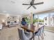 Open-concept living space with dining area, living room, and eat-in kitchen with breakfast bar at 213 Fernwood Cir # 213, Seminole, FL 33777
