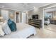 Spacious bedroom with neutral decor, a ceiling fan, and an ensuite bathroom at 213 Fernwood Cir # 213, Seminole, FL 33777