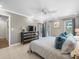 Comfortable bedroom with a ceiling fan, large dresser and access to outdoor views at 213 Fernwood Cir # 213, Seminole, FL 33777