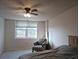 Bright bedroom featuring a large window and ceiling fan at 2333 Feather Sound Dr # A401, Clearwater, FL 33762