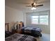 Bedroom featuring two beds, ceiling fan and a large bright window at 2333 Feather Sound Dr # A401, Clearwater, FL 33762